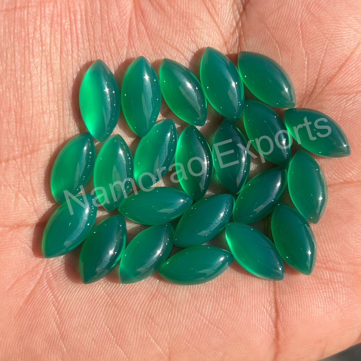 green gemstone crossword clue